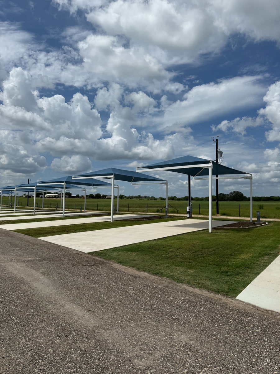 Permanent shade canopy over an oversized concrete RV pad
